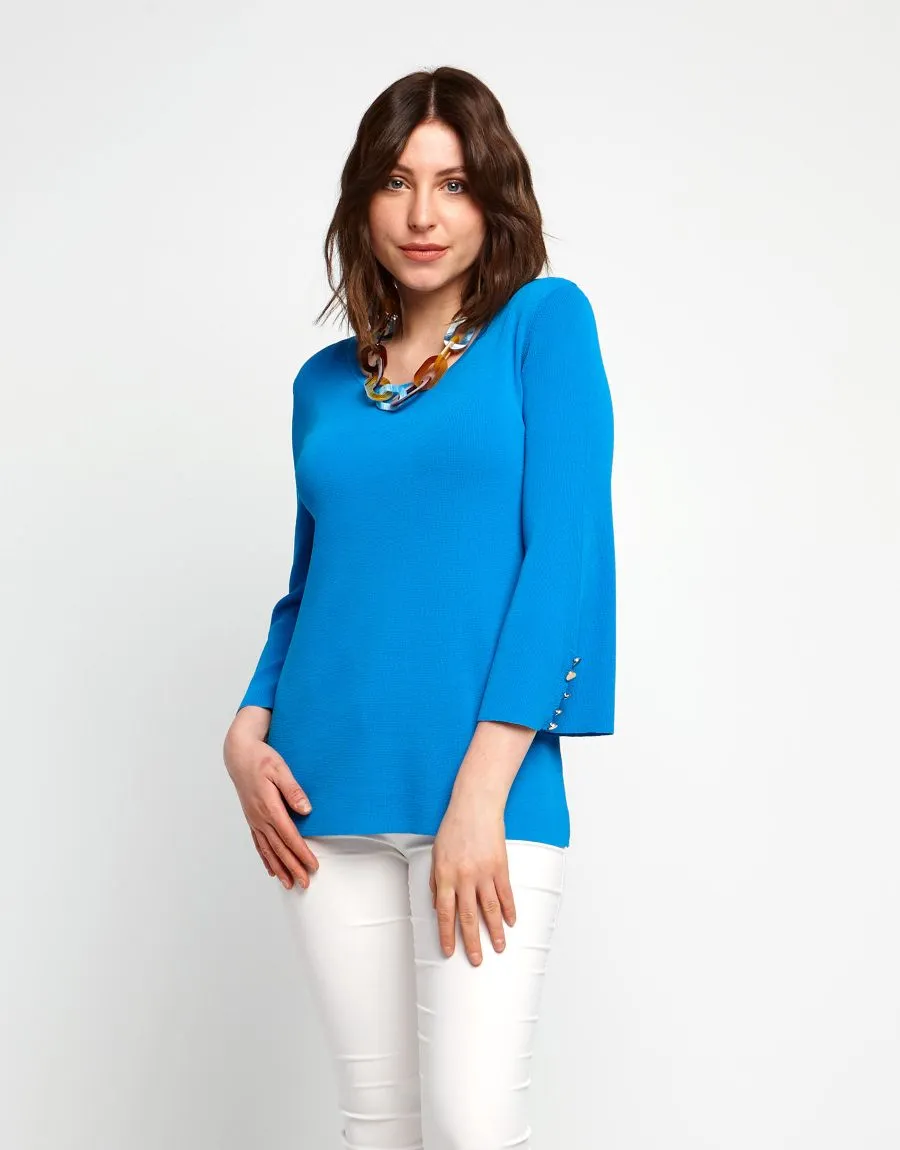 Maglia con bottoni ai polsi